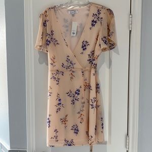 NWT!! Francesca’s blush wrap dress!